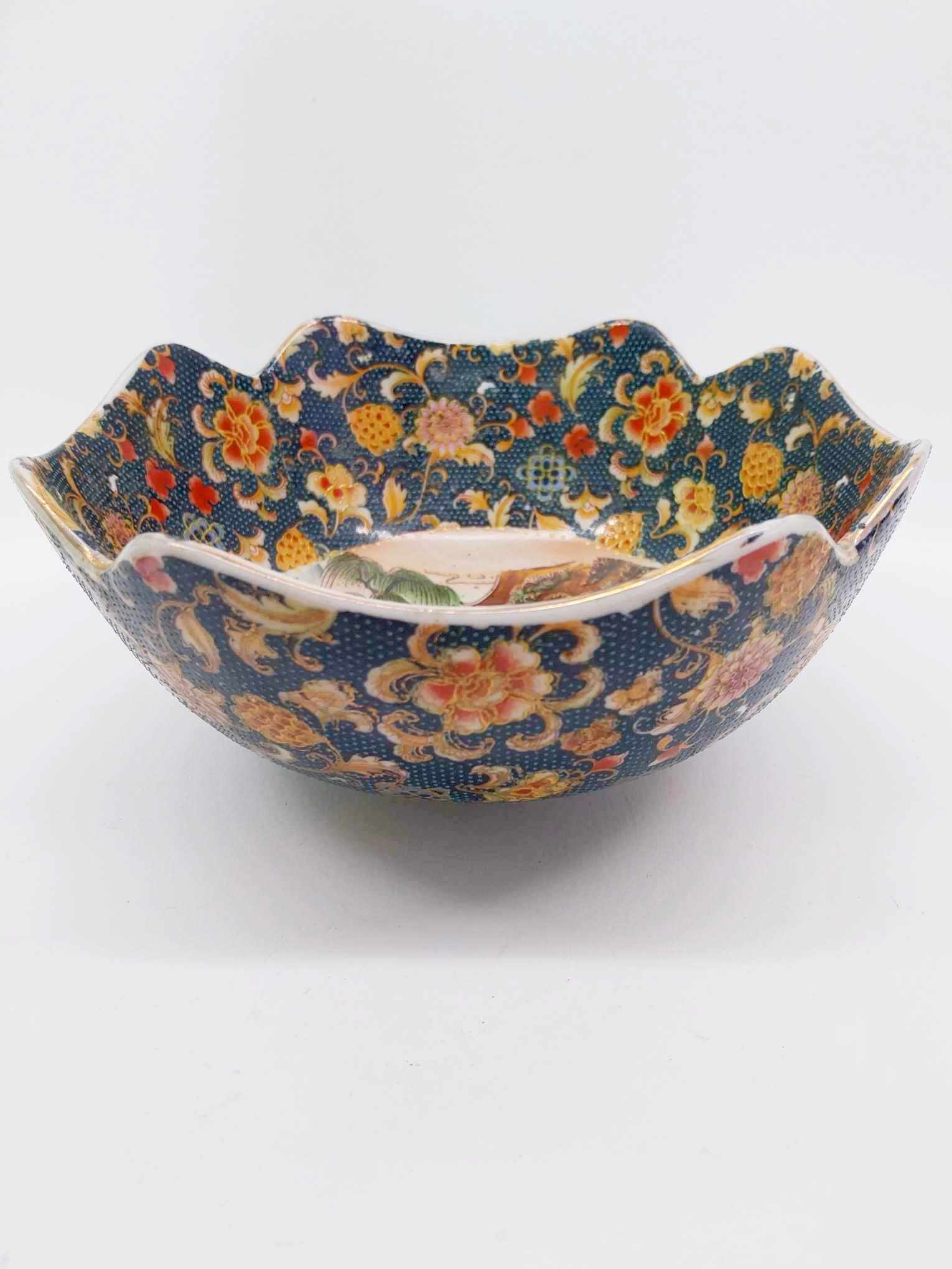 Vintage Japanese porcelain bowl with navy floral pattern, exterior view