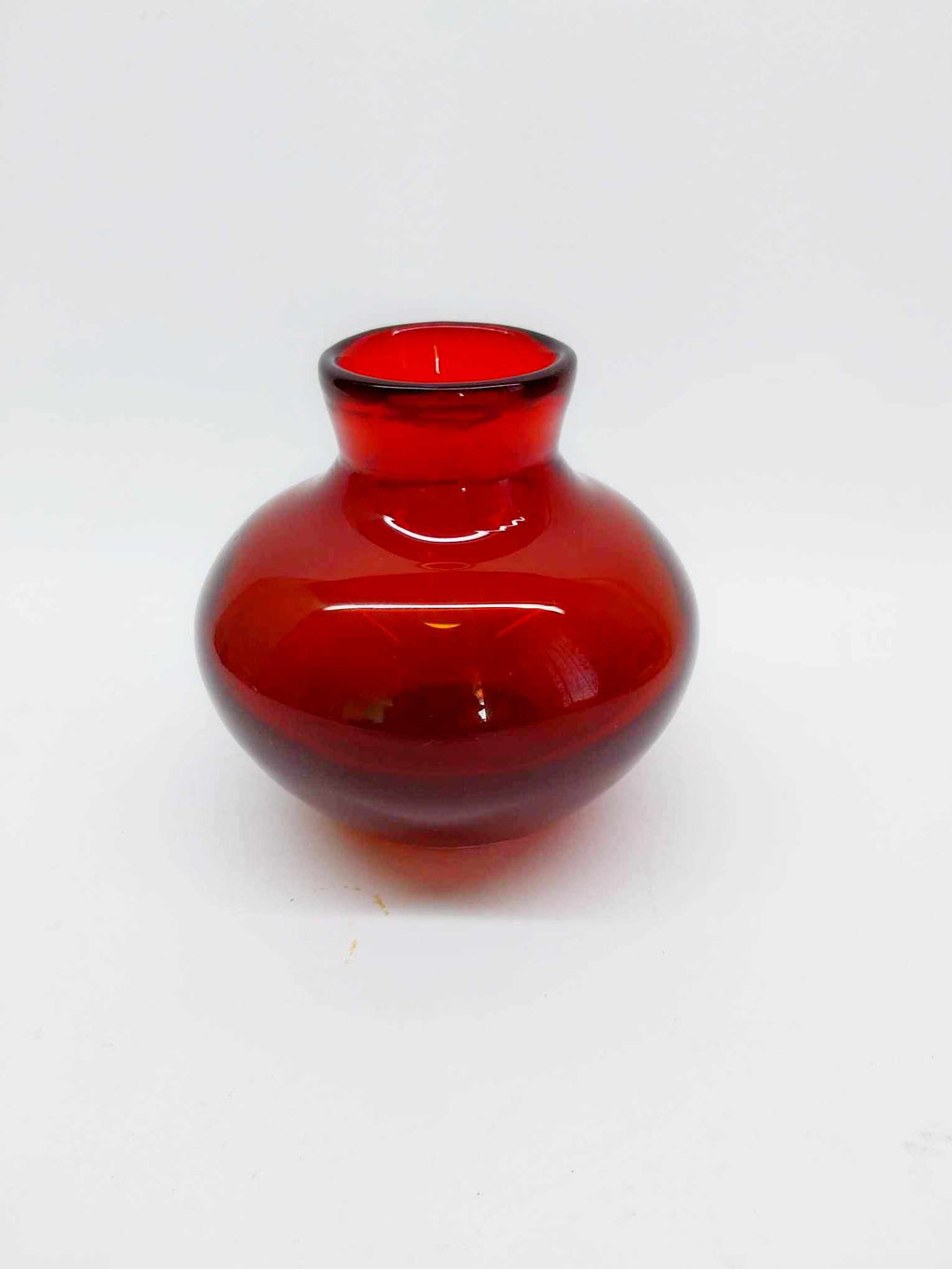 Vintage ruby-red glass vase from the 1980s, compact round form with narrow neck