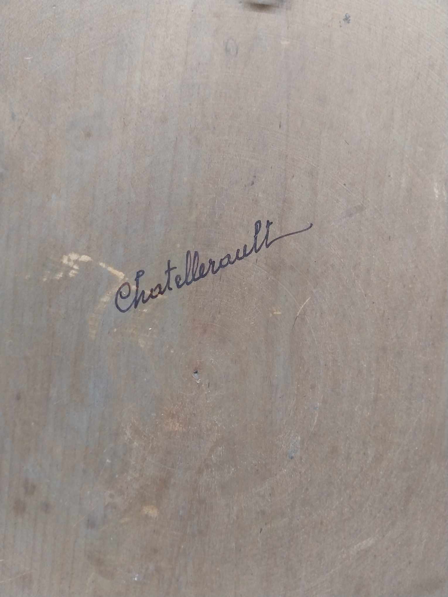 Back of vintage French decorative plate showing Châtellerault inscription
