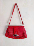 Vintage red polka dot shoulder bag with silver buckle and faux leather trim
