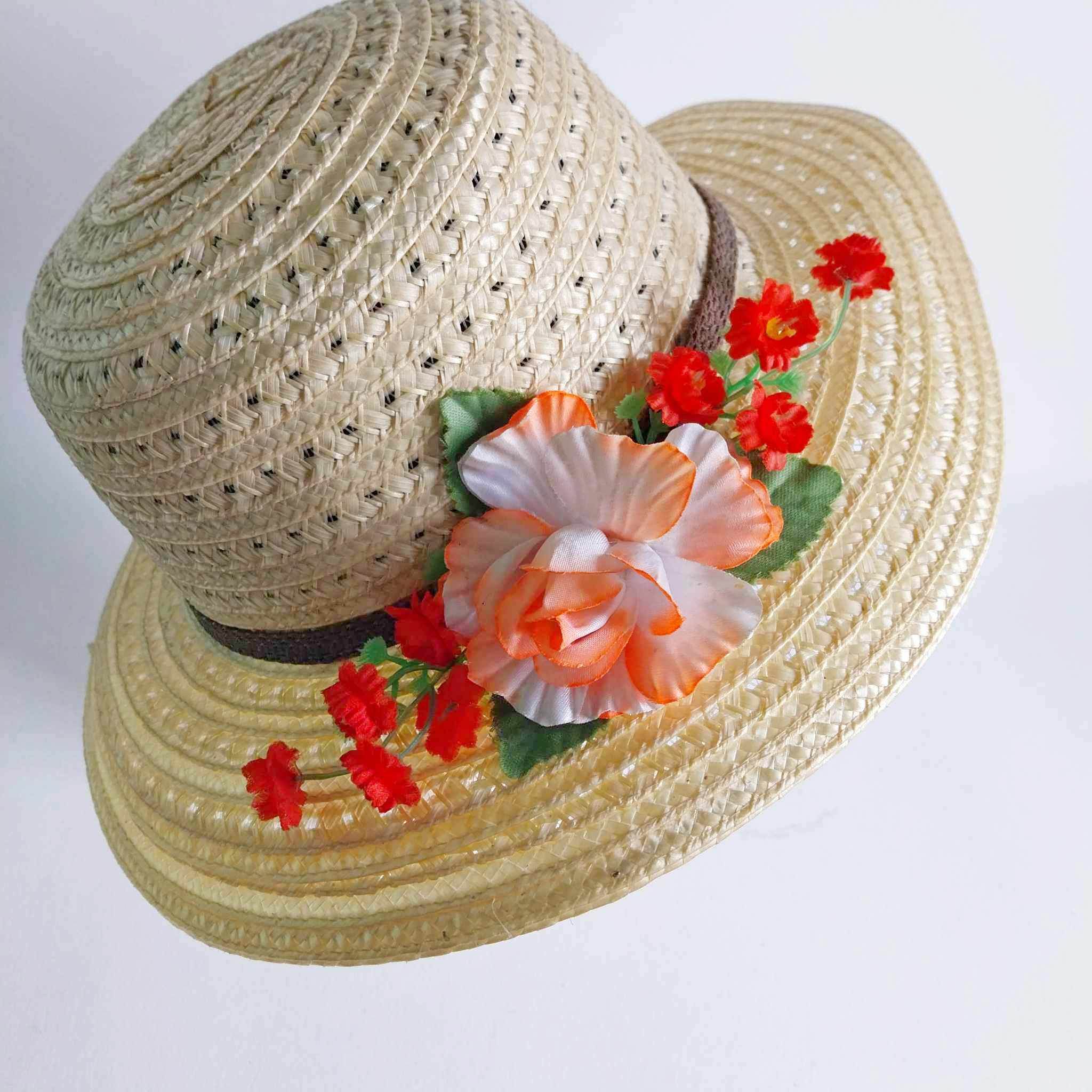 Vintage women's straw hat with flowers