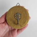 Vintage French wall hook — side view showing chenille texture