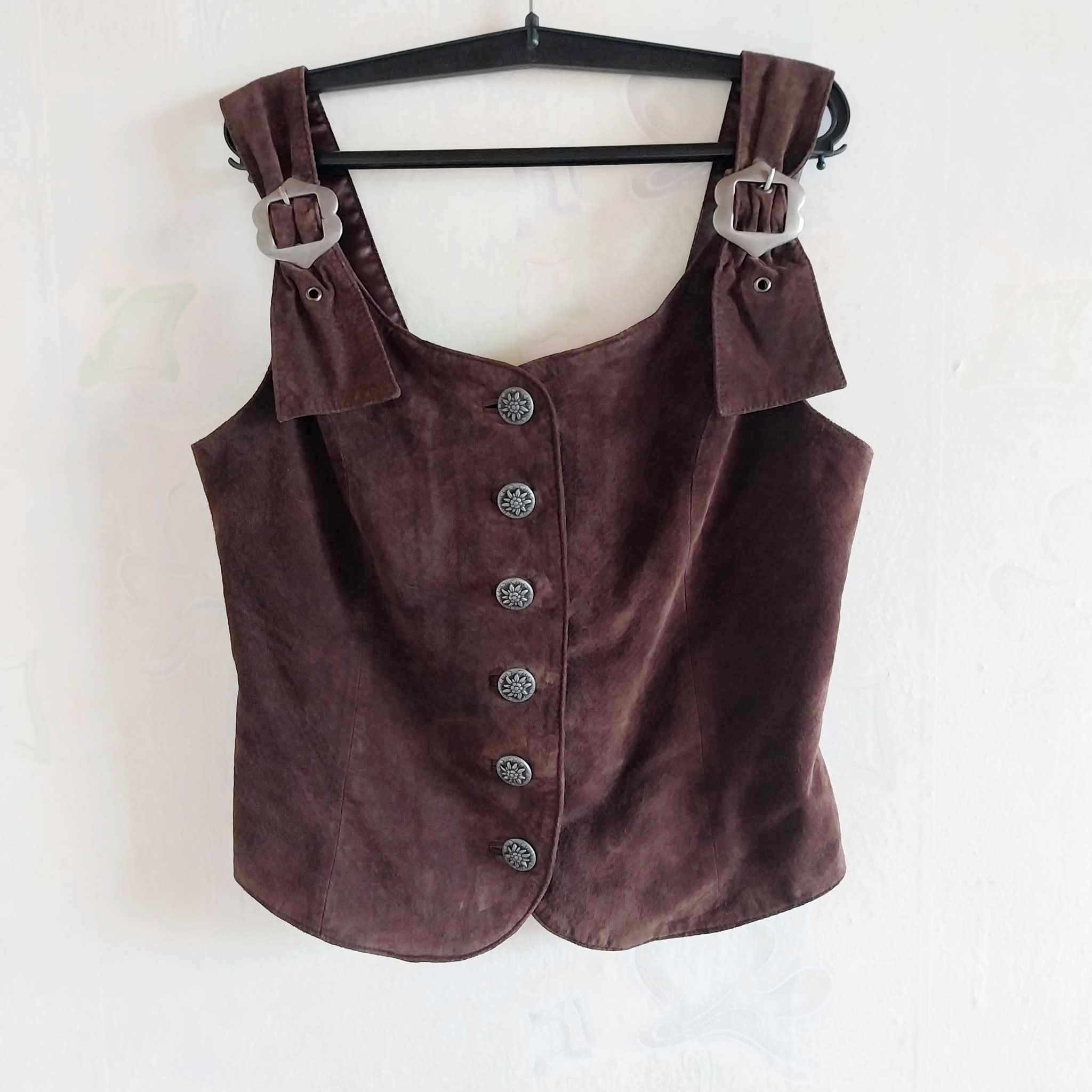 Vintage brown suede corset vest front view with lace-up closure, on hanger