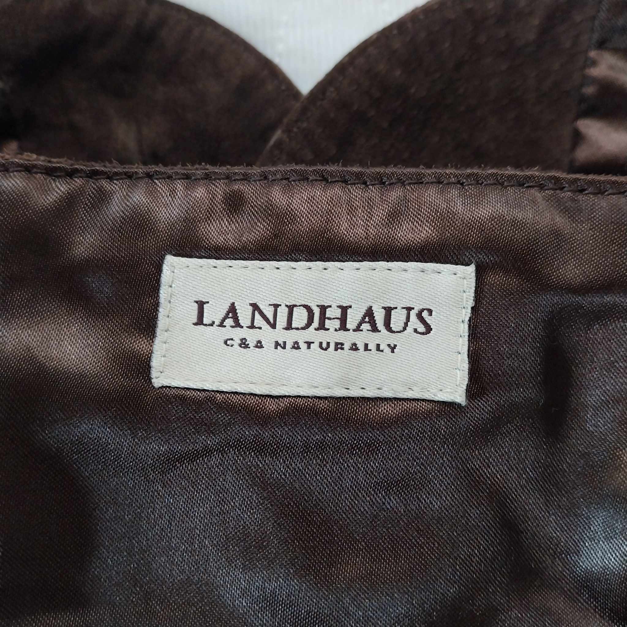 Vintage brown suede corset vest back view with edelweiss buttons and adjustable buckle straps