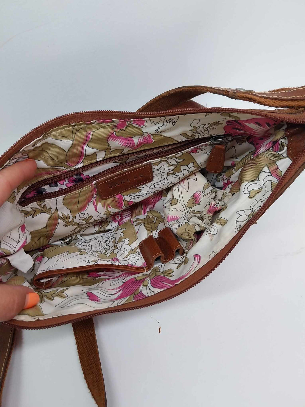 Varese vintage leather crossbody bag — interior floral lining with zip pocket