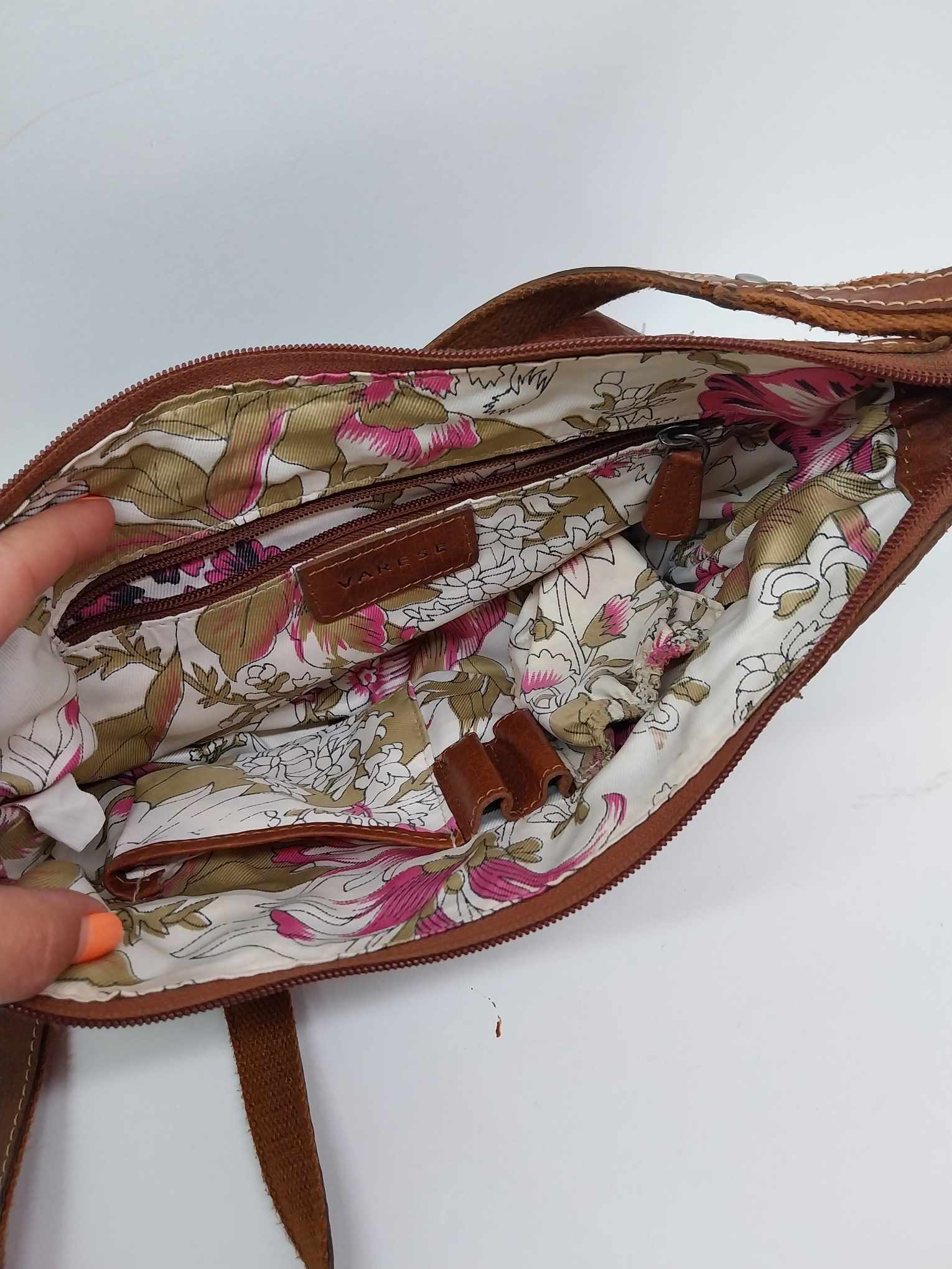 Varese vintage leather crossbody bag — interior floral lining with zip pocket