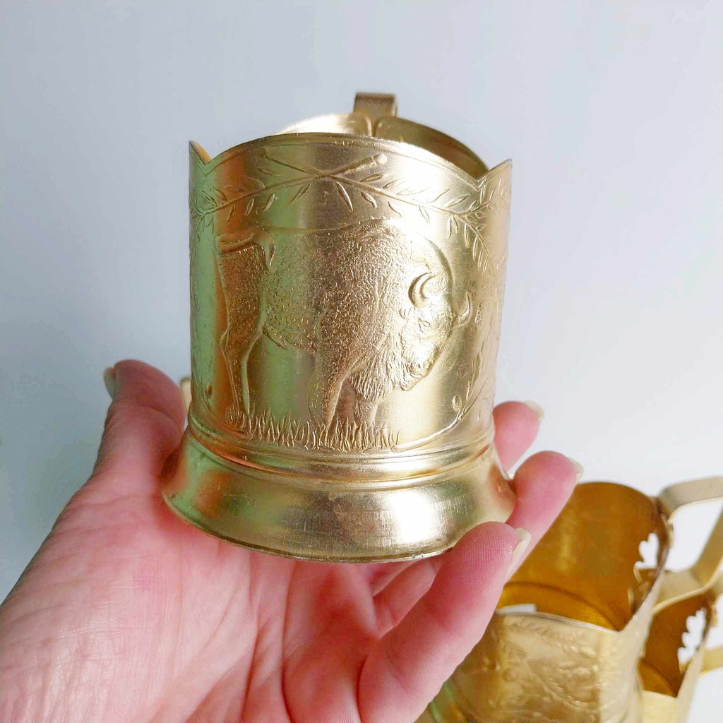 Vintage Soviet aluminium podstakannik with engraved bison motif — detail view
