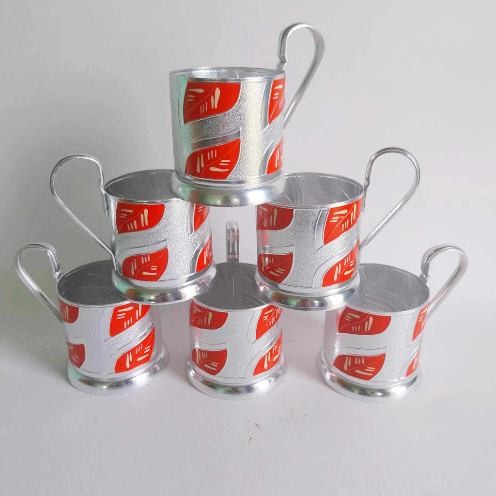 Set of 6 vintage Soviet podstakannik chrome tea glass holders with red and silver enamel decoration, stacked in pyramid