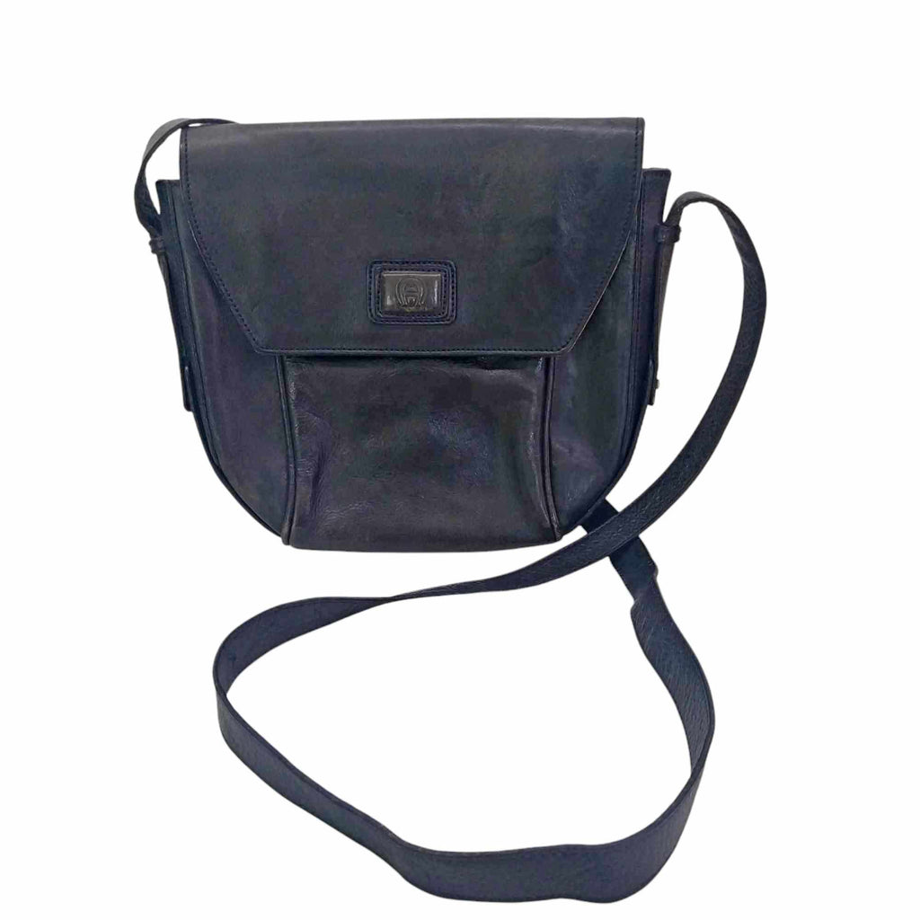 Vintage Etienne Aigner black leather crossbody bag with flap closure and adjustable strap
