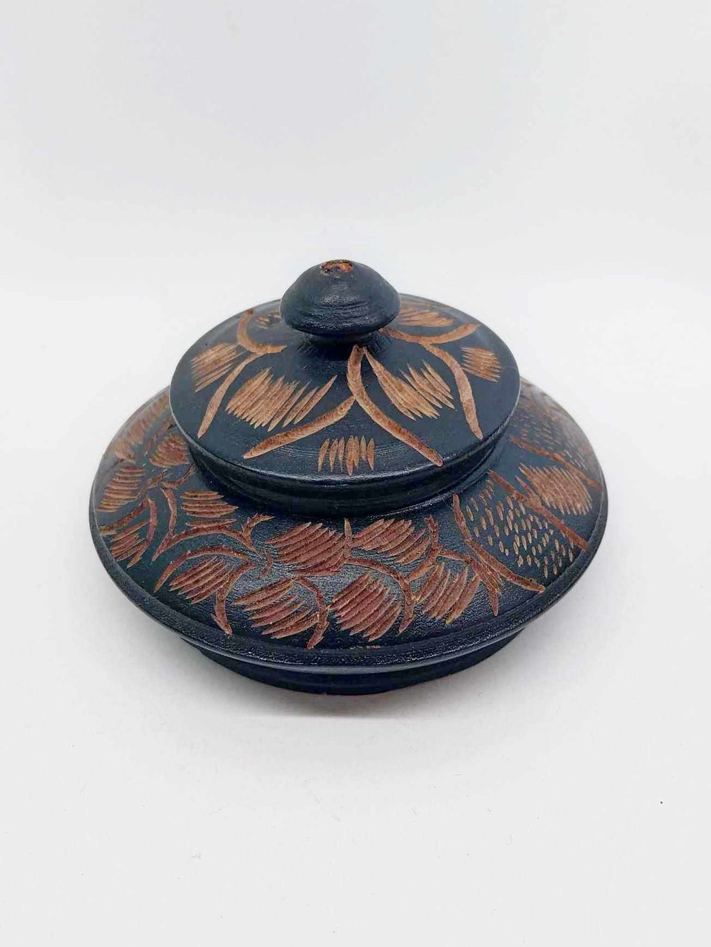 Vintage hand-carved wooden jewellery box closed with domed lid and knob handle, floral pattern