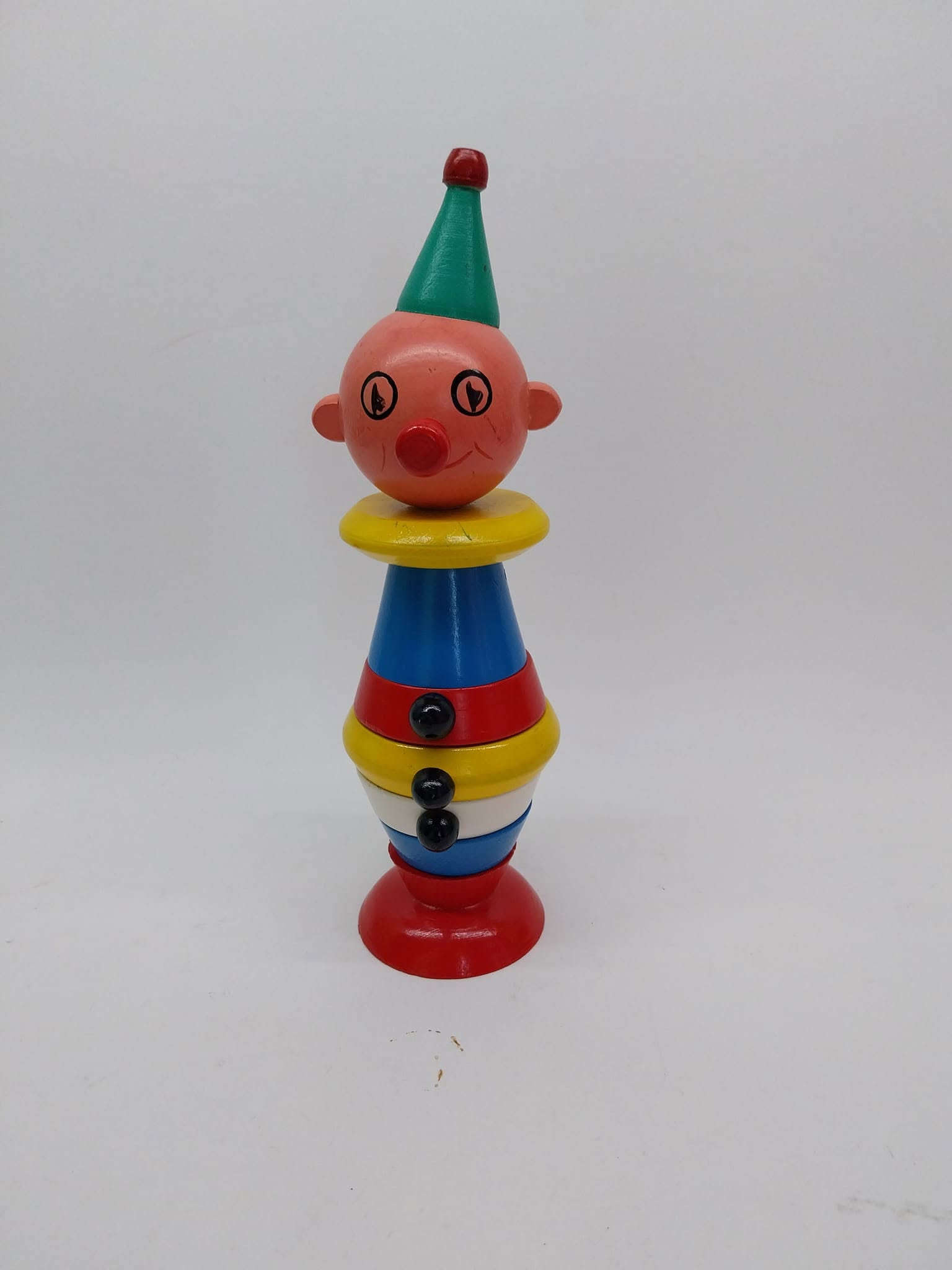 Vintage wooden stacking clown puzzle toy in primary colours
