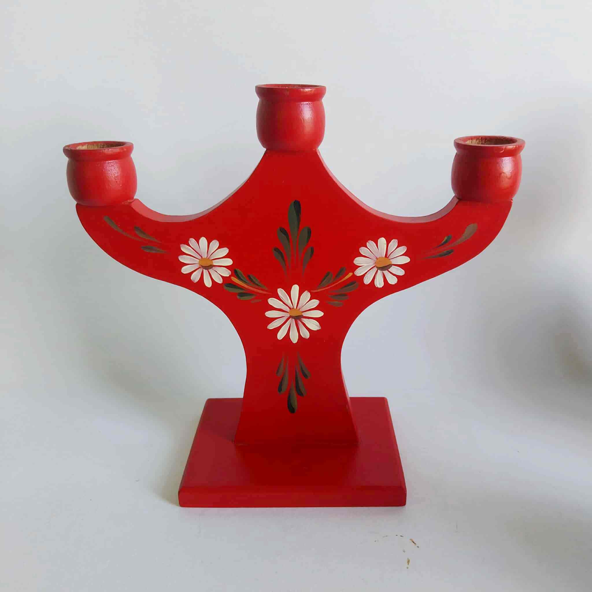Vintage red wooden three-arm candelabra with hand-painted white daisy folk motifs