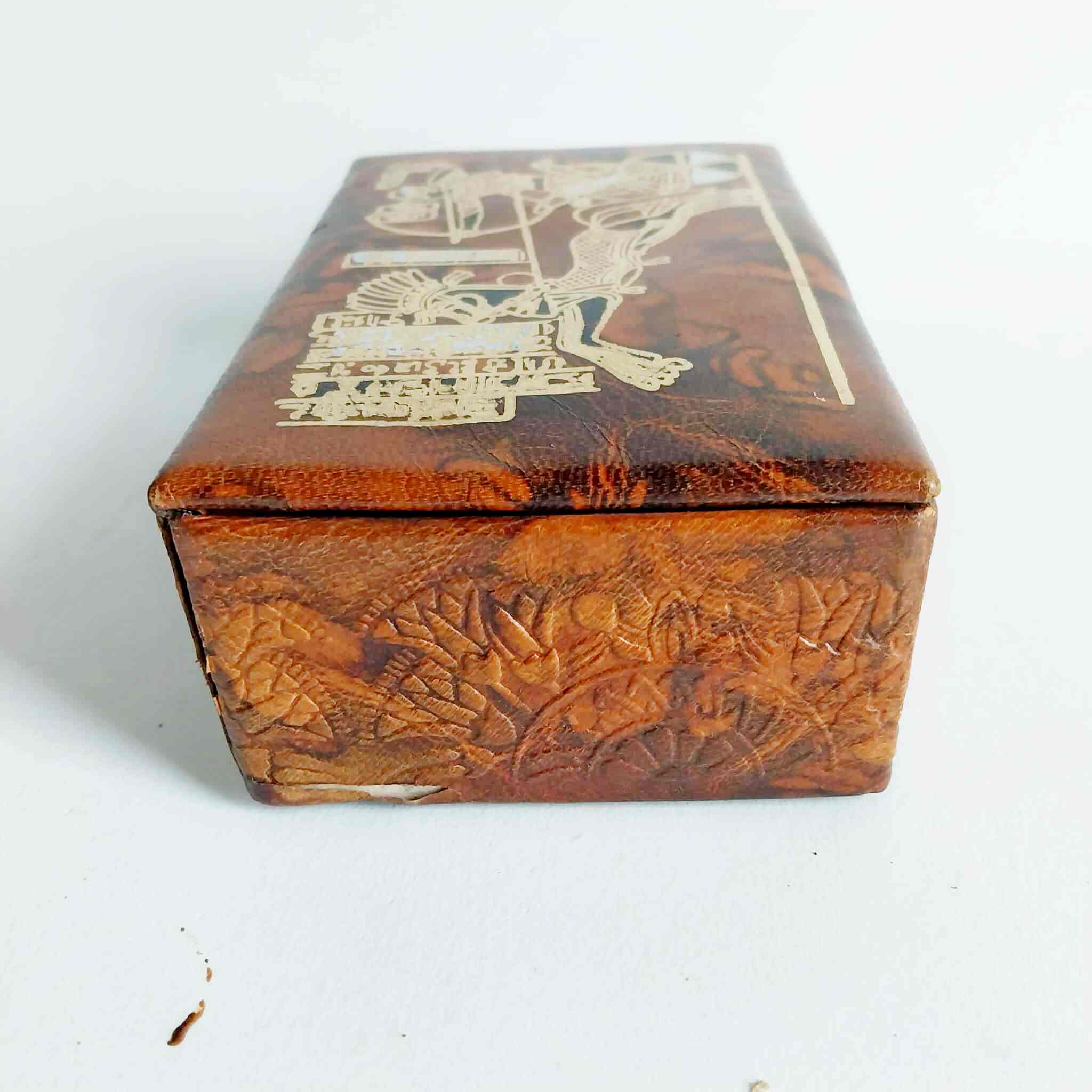 Side view of vintage leather jewelry box showing embossed texture