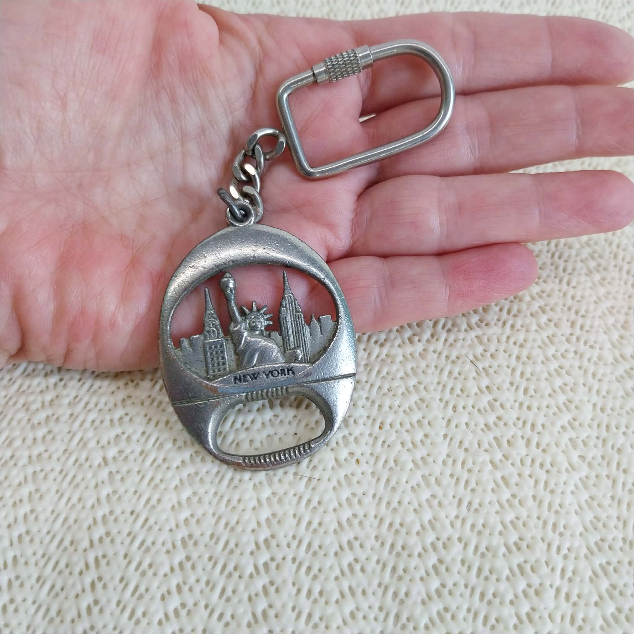 Vintage New York keychain bottle opener – front view in hand