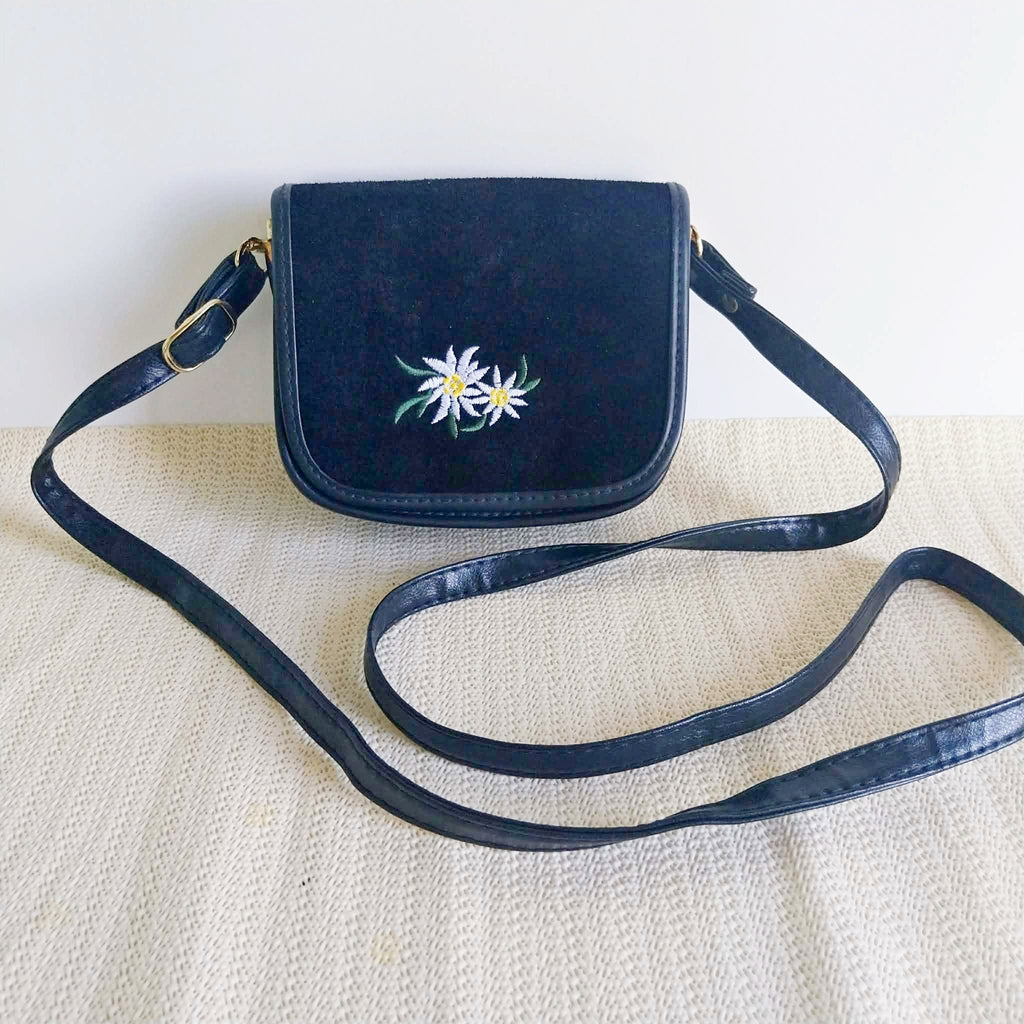 Vintage navy blue edelweiss crossbody bag with suede flap and adjustable strap