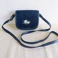 Vintage navy blue edelweiss crossbody bag with suede flap and adjustable strap