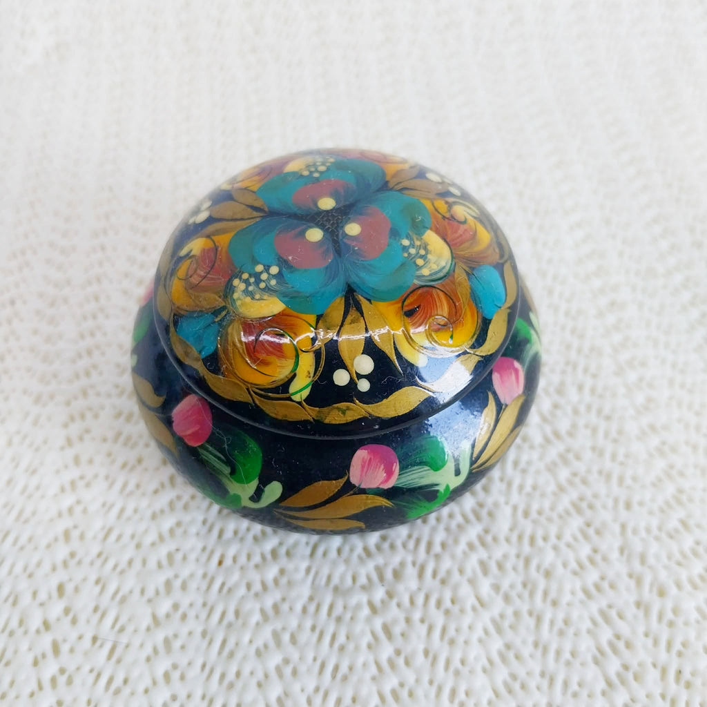 Vintage Ukrainian lacquered wooden trinket box closed — Petrykivka floral motifs on black