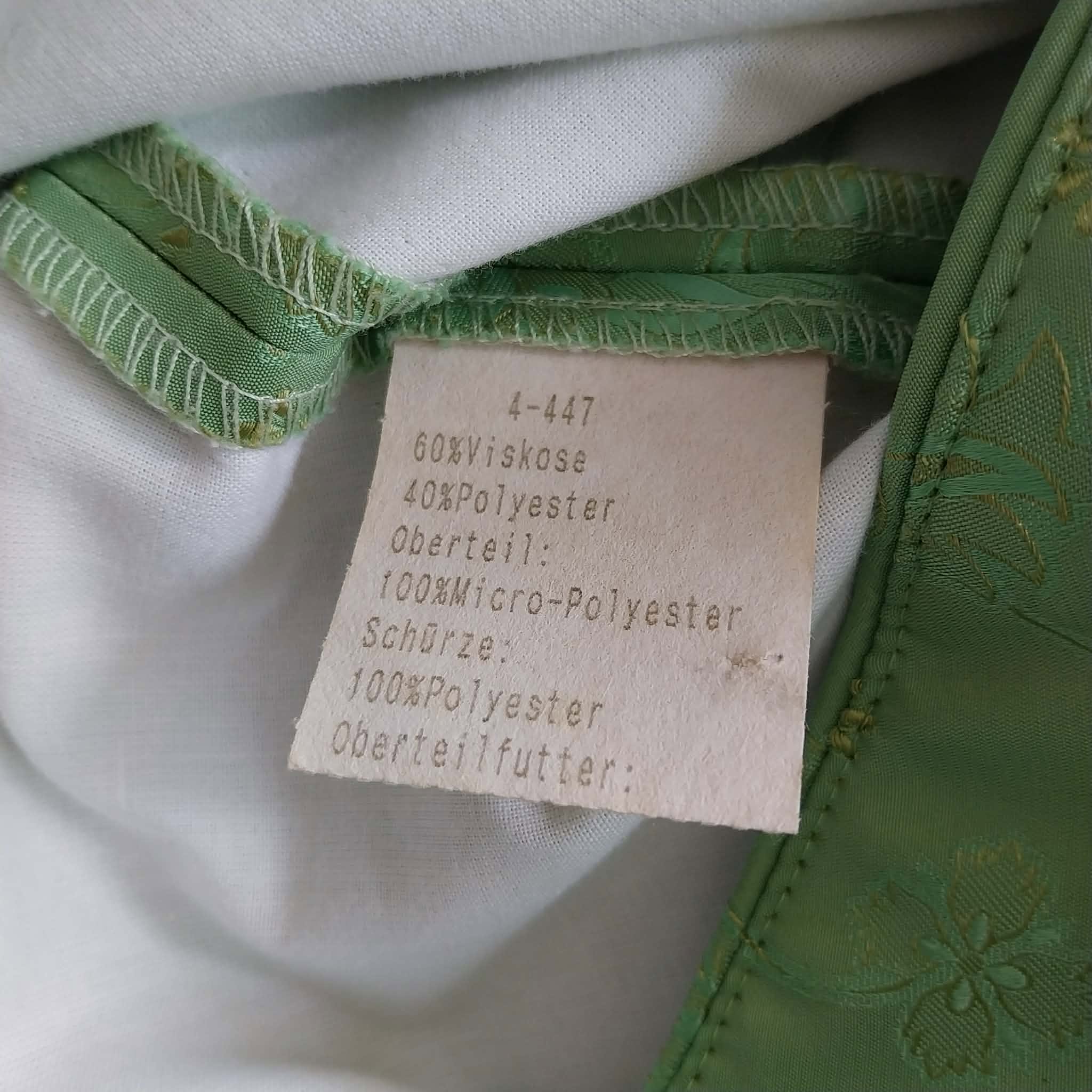 Care label of Lisa's Landhaus Dirndl showing fabric composition