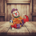 Vintage resin clown figurine in vintage setting