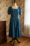 Vintage teal blue Dirndl-style dress on mannequin